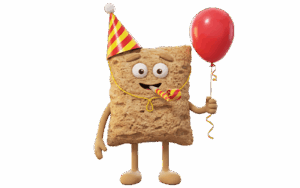 Frasse firar födelsedag med partyhatt och ballong.